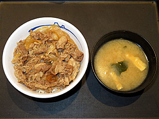 ���߂���